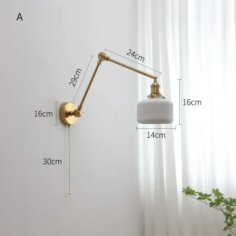 Gold-finished modern brass copper swing arm wall sconce with white ribbed glass shade for bedroom decorbites copper swing