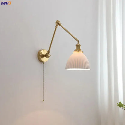 Modern brass copper swing arm wall sconce with ribbed off-white glass shade and pull-chain switch for bedroom decorbites copper swing