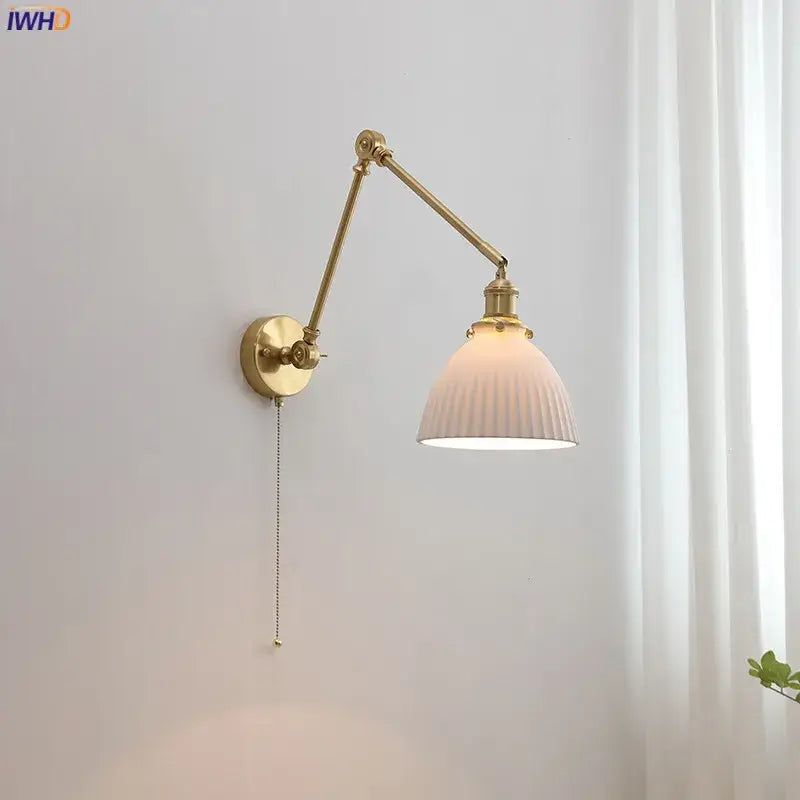 Modern brass copper swing arm wall sconce with ribbed off-white glass shade and pull-chain switch for bedroom decorbites copper swing
