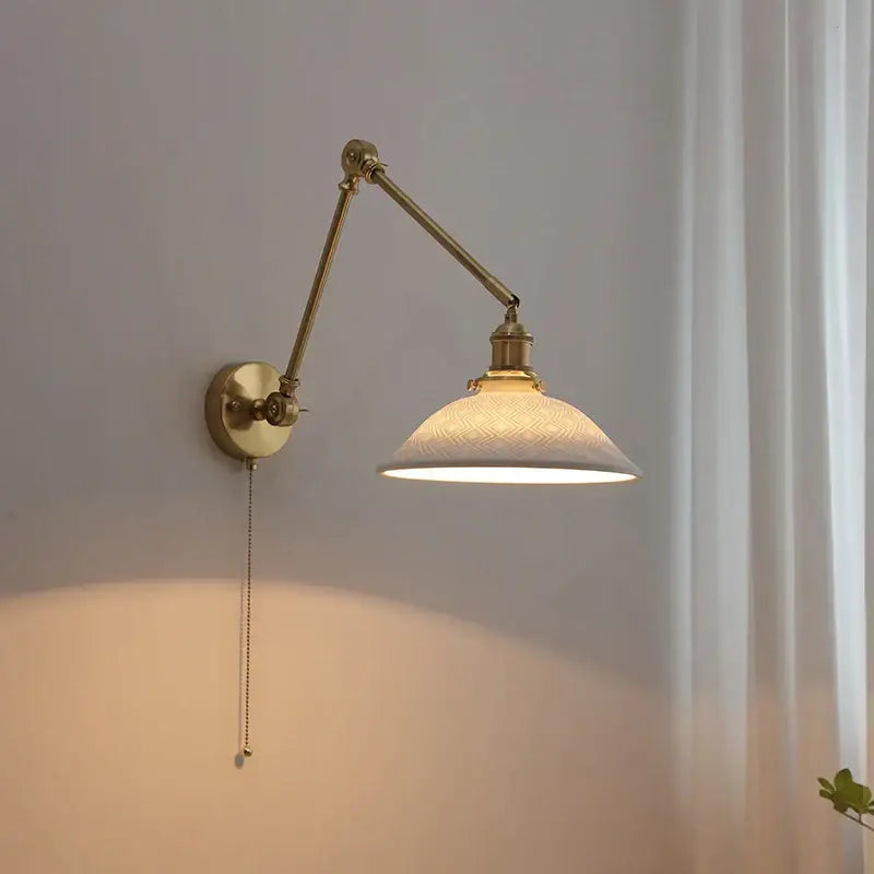 Brass-finished decorbites copper swing arm wall sconce with adjustable embossed frosted glass shade for bedroom lighting
