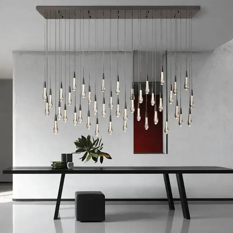 Modern brass crystal ceiling pendant light with slender teardrop glass bulbs on a sleek metallic frame for dining room decorbites brass crystal