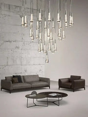 Modern brass crystal ceiling pendant light with teardrop-shaped glass and sleek metallic finish for dining room decorbites brass crystal