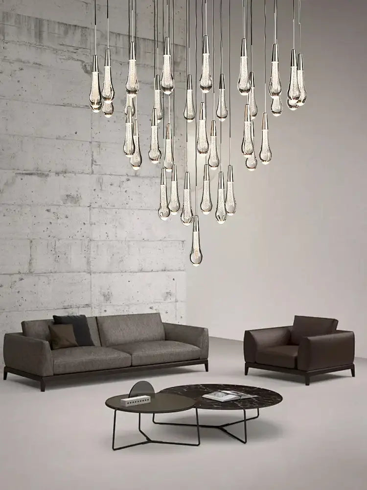 Modern brass crystal ceiling pendant light with teardrop-shaped glass and sleek metallic finish for dining room decorbites brass crystal
