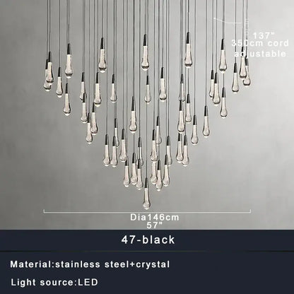 Modern brass crystal ceiling pendant light with 47 black and clear teardrop led fixtures on stainless steel cords