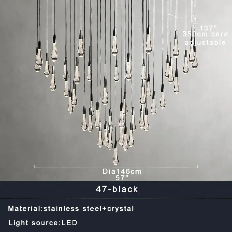 Modern brass crystal ceiling pendant light with 47 black and clear teardrop led fixtures on stainless steel cords