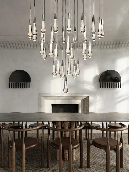 Modern brass crystal ceiling pendant light with teardrop-shaped glass and metallic fixtures for dining room decorbites brass crystal
