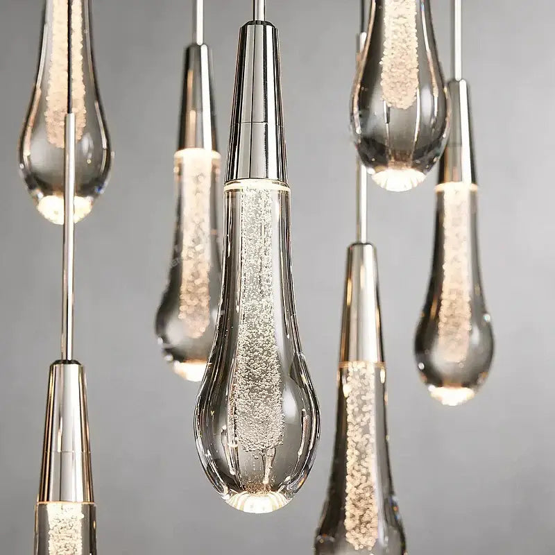 Modern brass crystal ceiling pendant light with clear glass teardrop and silver metallic caps for dining room decorbites brass crystal
