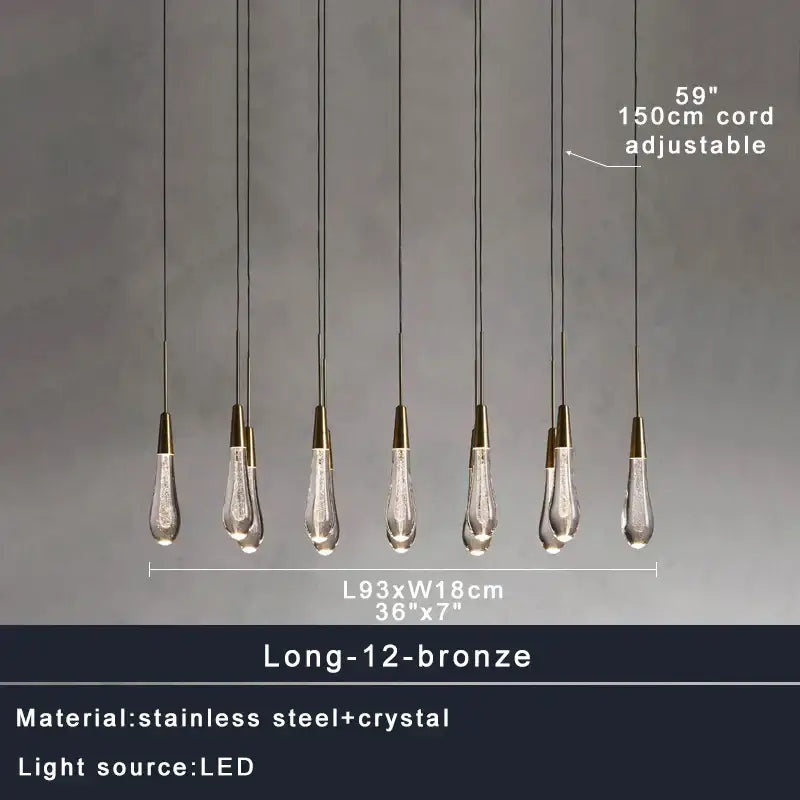 Set of twelve decorbites brass crystal pendant lights with clear teardrop shades and bronze metal tops for dining room