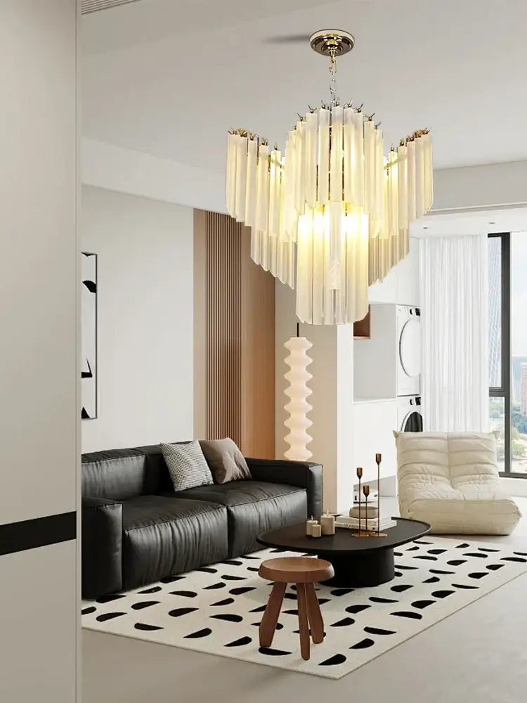 Modern brass crystal glass chandelier with golden finish and translucent cascading rods for dining room decorbites crystal glass