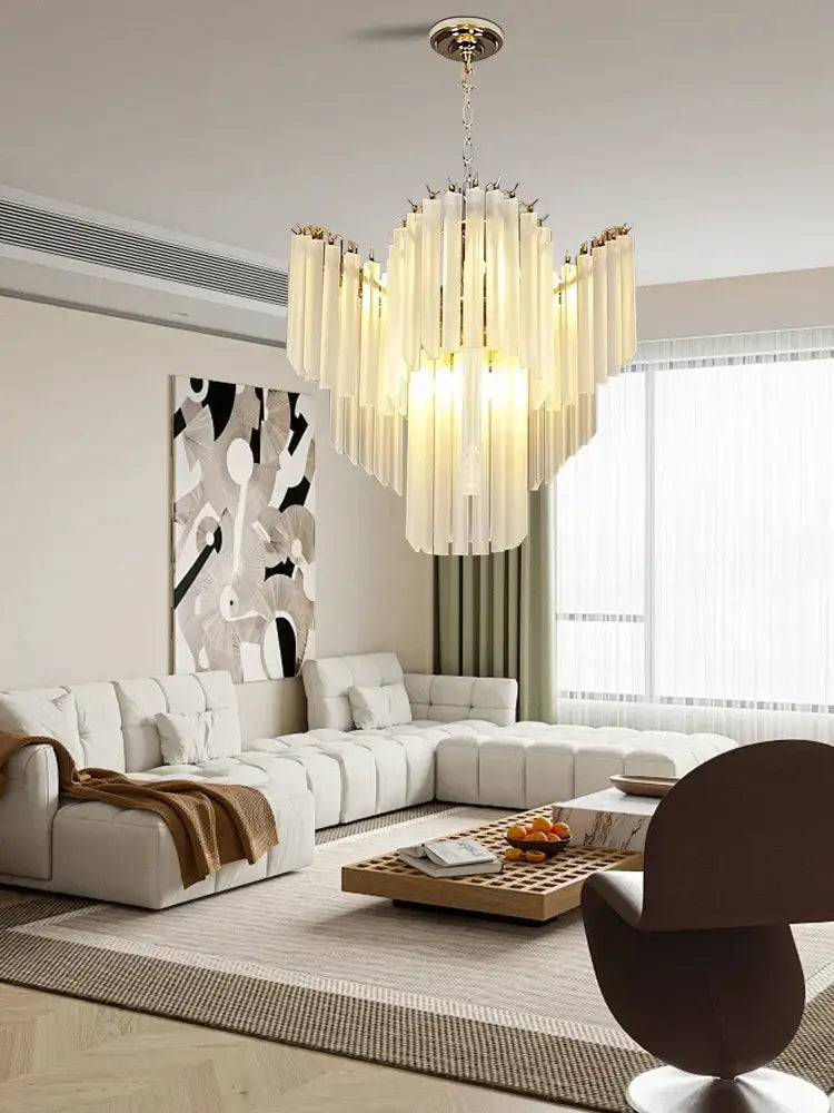 Modern brass crystal glass chandelier with translucent cascading rods for dining room by decorbites crystal glass