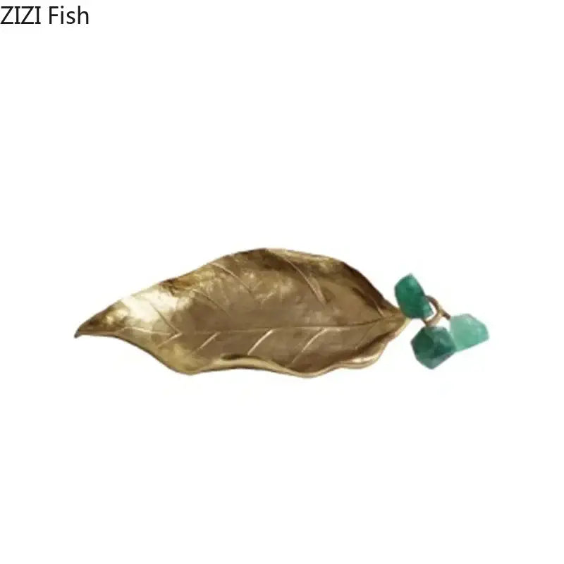 Gold-toned leaf-shaped brooch with two faceted green gemstones in brass crystal grape living room sculpture design