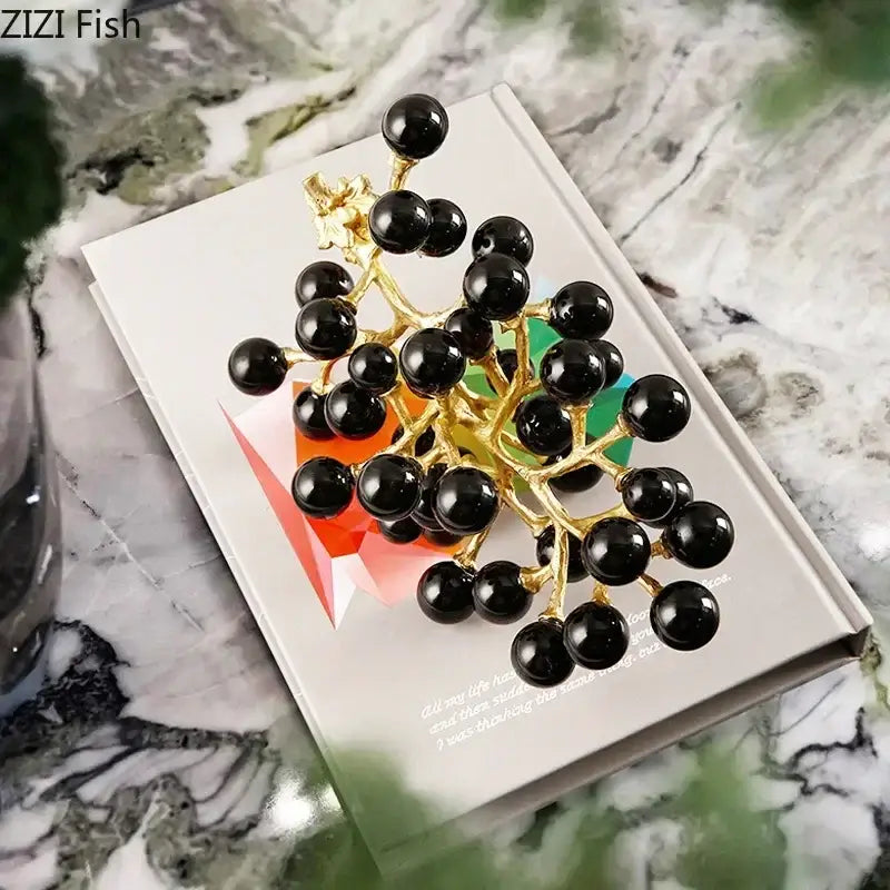 Modern brass crystal grape cluster brooch with gold-toned metal and glossy black spherical beads for decor use