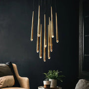 Modern brass crystal led pendant chandelier featuring slender tapered rods and warm bulbs for villa stairs decorbites crystal led