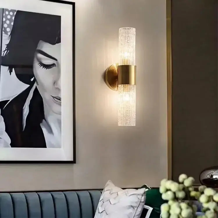 Modern brass crystal led wall lamp featuring a textured translucent glass cylinder with a polished brass base decorbites crystal led wall