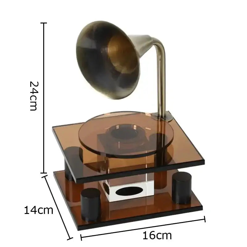 A miniature vintage-style brass gramophone with amber acrylic base and black feet for decorbites crystal music equipment