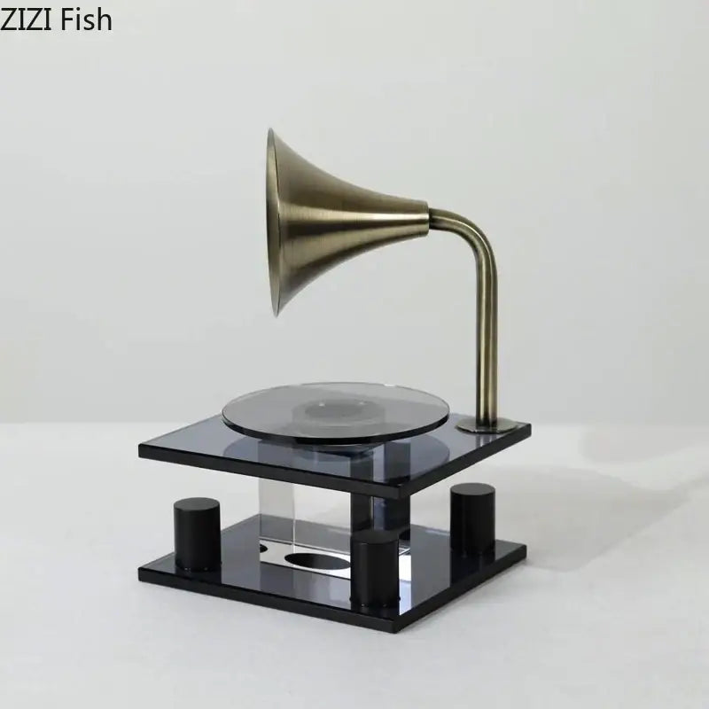 Bronze gramophone-style 3d scanner with black acrylic base and cylindrical supports for modern decorbites crystal music equipment