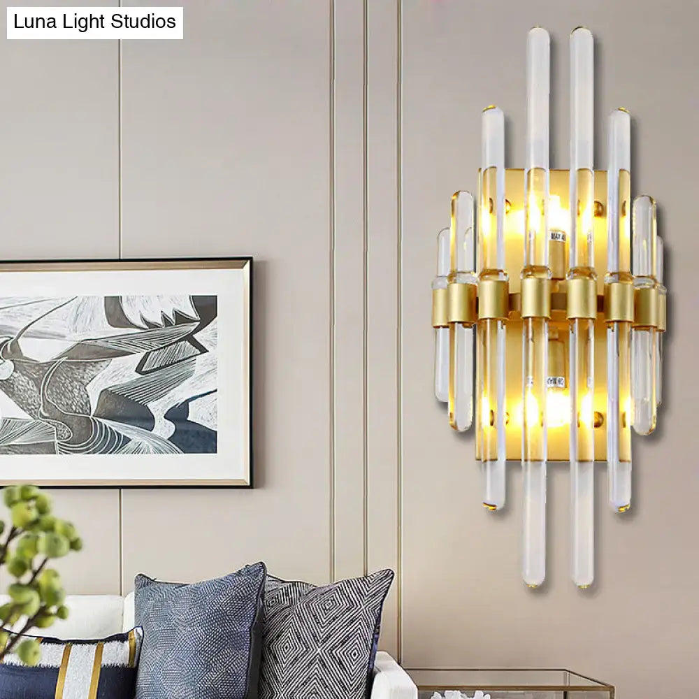 Modern brass crystal tube wall lighting featuring a gold-toned sconce with clear crystal tube design for living rooms