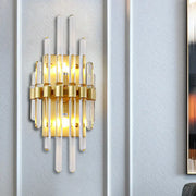 Modern brass wall sconce with clear crystal tube and frosted glass tubes for elegant tube wall lighting in living rooms