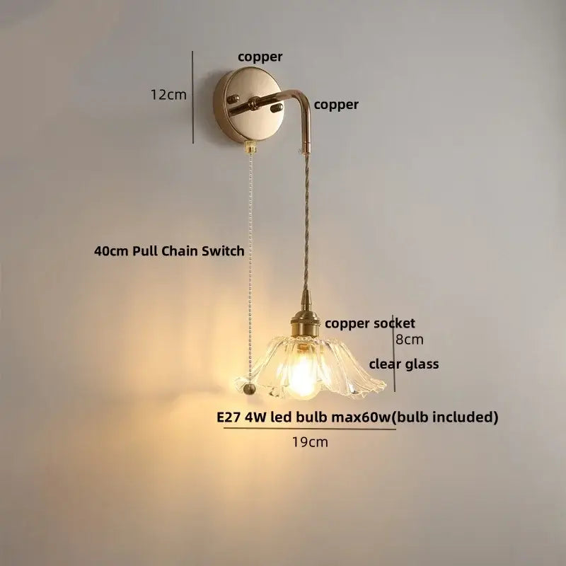 Modern brass crystal wall lamp with copper finish, clear glass flower shade, 8cm socket, and 40cm pull chain switch