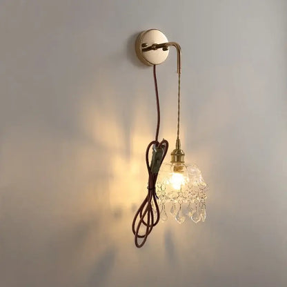 Modern brass wall lamp with clear glass crystal chandelier shade and braided brown cord for bathroom mirror lighting decorbites clear glass