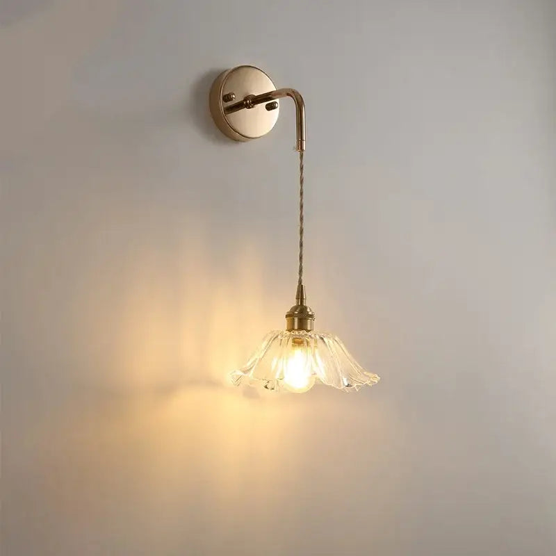 Modern brass crystal wall lamp with clear glass petal shade and twisted cord for bathroom mirror decorbites clear glass