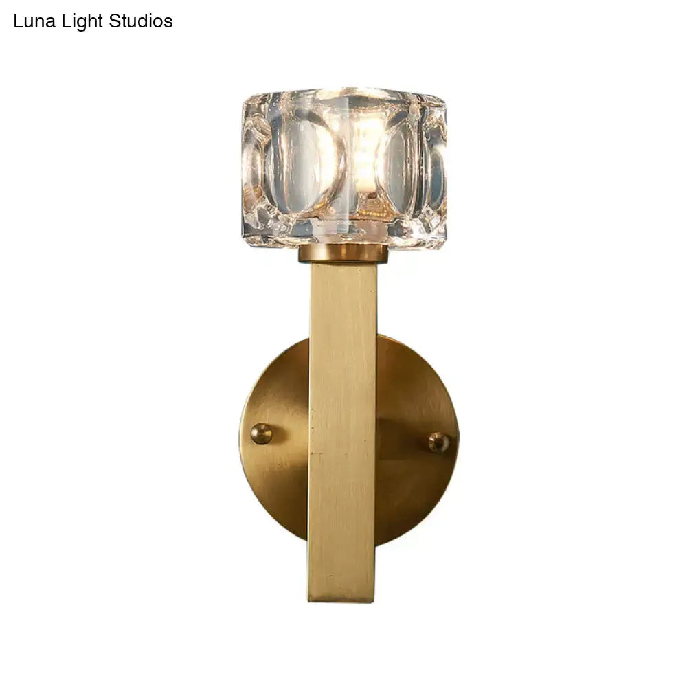 Modern brass crystal wall sconce with faceted shade and sleek metal stem for contemporary cube flush wall lighting