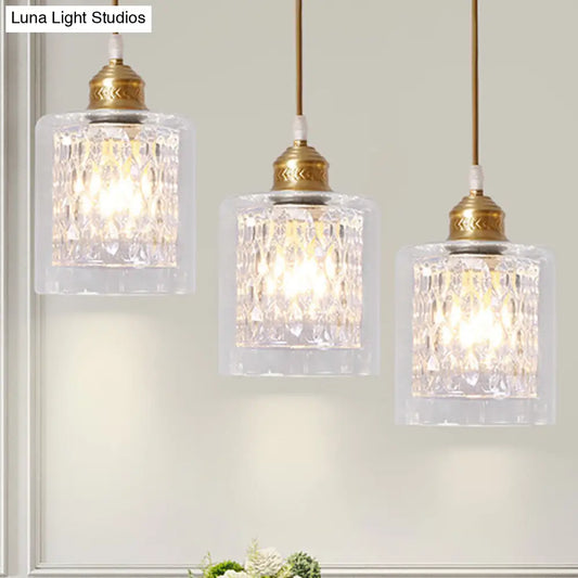 Modern Brass Cylinder Pendant Light with Prismatic Glass Shade - 3 Lights, Linear/Round Canopy