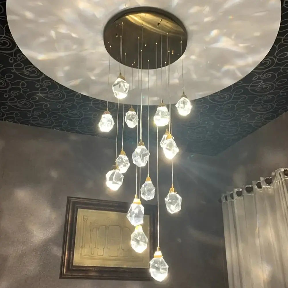 A modern brass decorbites crystal led chandelier with clear faceted glass pendants for living room lighting