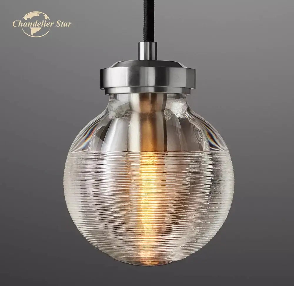 Clear ribbed glass globe pendant light with brushed metal top and black cord in decorbites crystal pearl design