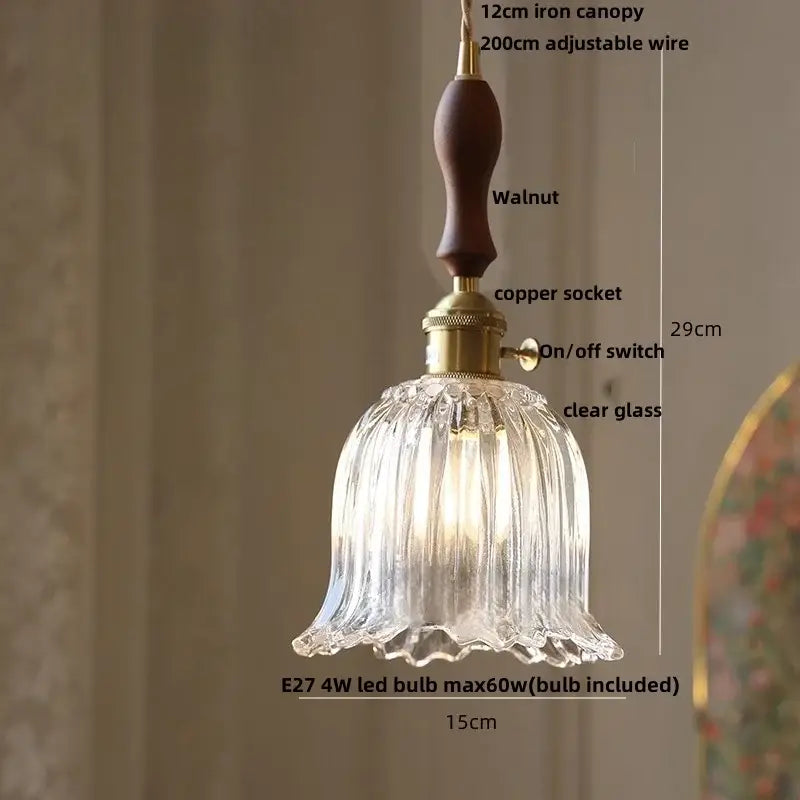 A clear glass pendant lamp with a fluted bell shade and walnut iron canopy for modern brass decorbites cube amber decor
