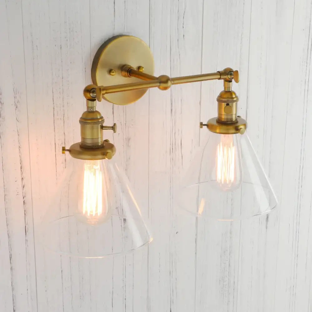 Modern brass decorbites funnel glass wall sconce with two clear glass shades and exposed filament bulbs light fixture