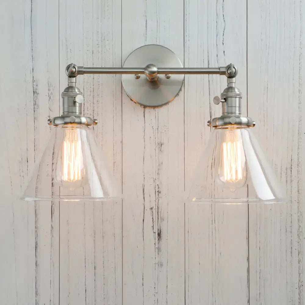 Stylish brushed nickel two-light wall sconce with clear decorbites funnel glass shades for bedroom light fixture