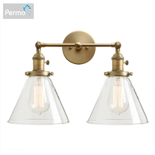 Modern brass decorbites funnel glass wall sconce with brass finish, two clear glass conical shades, and exposed filament bulbs