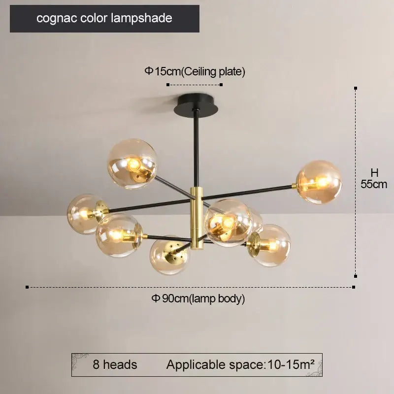 Modern brass decorbites glass ball led chandelier with cognac-colored glass globe and black and brass accents for kitchen lighting