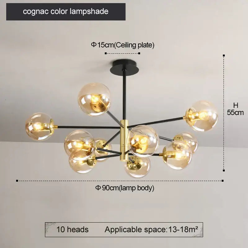 Cognac-colored decorbites glass ball led chandelier with central brass fixture and black arms for modern kitchen lighting
