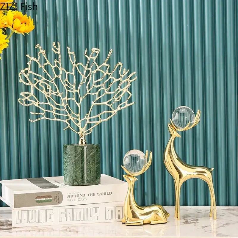 Modern brass deer statue desk ornament with gold-colored metallic coral sculpture and dark green marble base decorbites brass deer