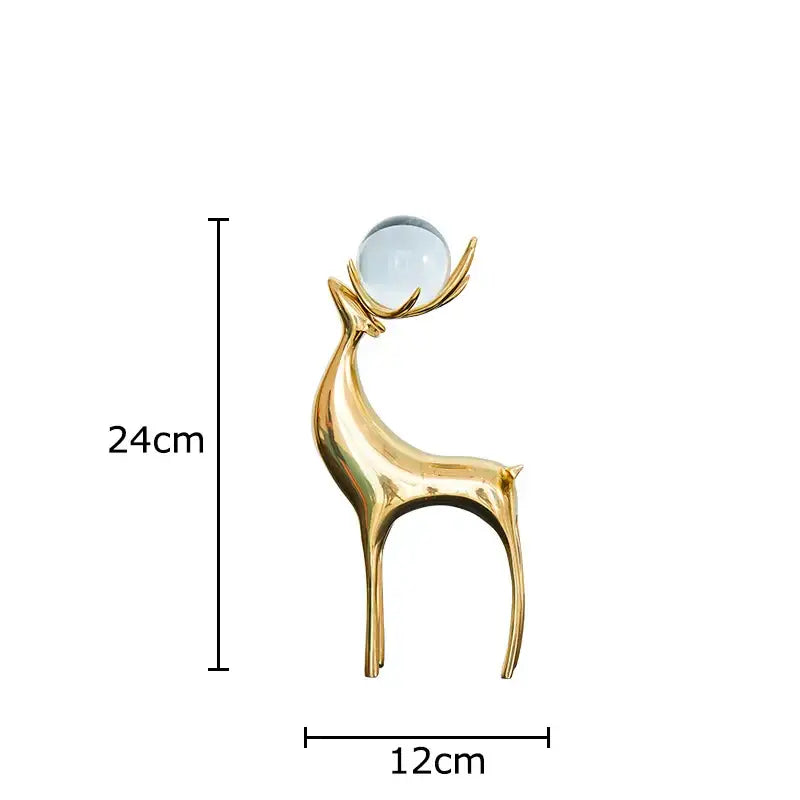 Modern brass deer statue desk ornament with sleek golden finish and translucent blue glass sphere for living room decorbites brass deer