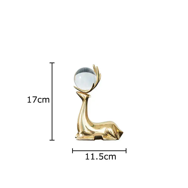 Modern brass deer statue desk ornament with clear glass sphere perched on golden antlers for living room decorbites brass deer
