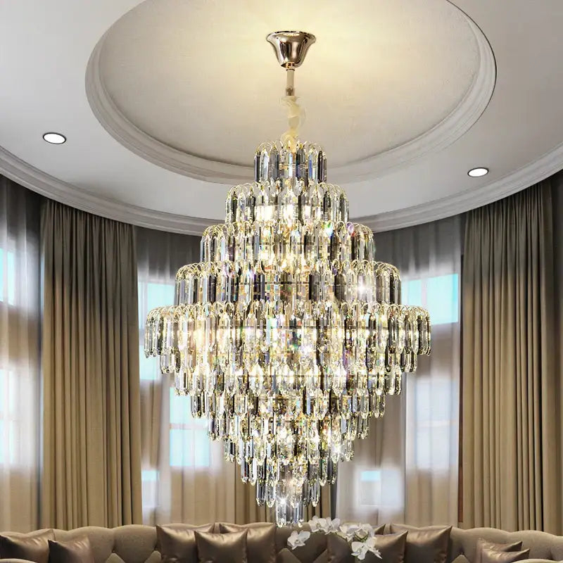 Modern brass designer led crystal chandelier with cascading glass prisms and polished brass mount for dining room decorbites designer led