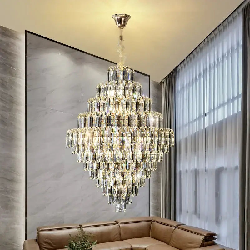 Modern brass designer led crystal chandelier with polished chrome finish and cascading clear crystals for dining room decorbites designer led lighting