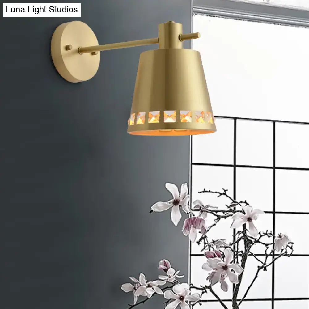 Modern brass wall lamp with gold-toned conical shade and diamond cutout patterns emits warm light, compatible with e26 e27 bulbs