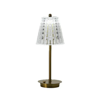 Modern brass diamond touch desk lamp with clear faceted crystal lampshade and gold-toned metal base and stem