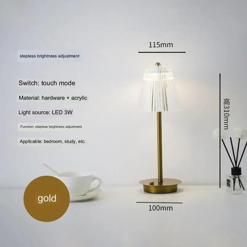 Modern brass diamond touch desk lamp with gold finish slender stem and translucent fringed acrylic shade for bedroom use