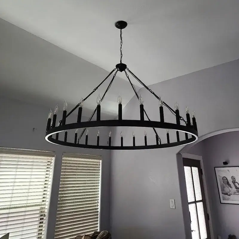 Modern brass double tier pendant chandelier with black wrought iron circular ring and candle-style black metal led bulbs