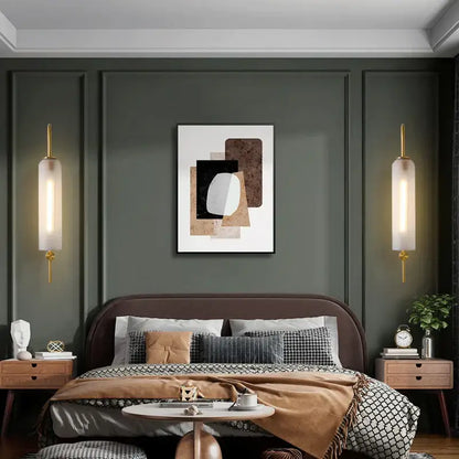 Abstract geometric artwork with layered black white beige and brown shapes complements modern brass e27 glass wall light bedroom sconce