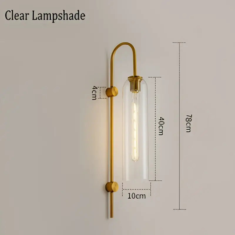 Modern brass e27 glass wall light with gold-toned finish and clear glass shade for bedroom sconce lighting