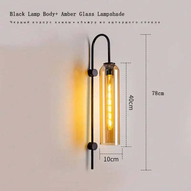 A sleek black wall light with amber e27 glass shade and exposed bulb modern brass glass wall light bedroom sconce