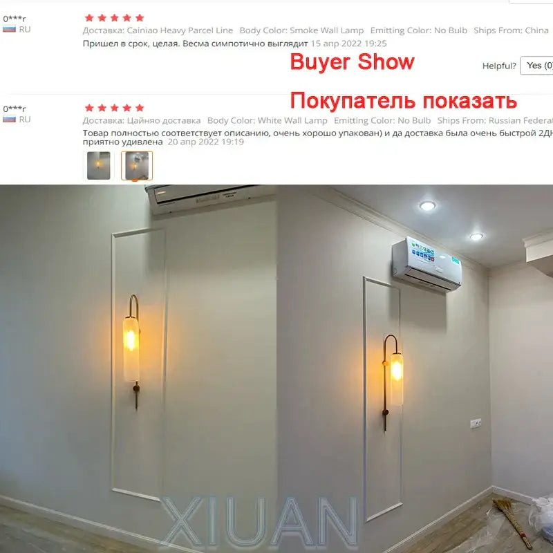 Modern brass e27 glass wall light with smoke-colored warm-glowing shade and slender curved metal frame for bedroom use