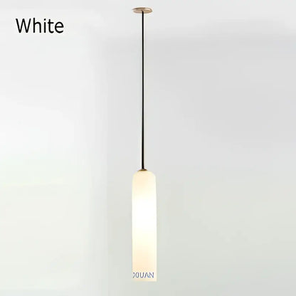 Modern brass e27 glass wall light with white cylindrical frosted glass shade and black hanging cord for bedroom sconce