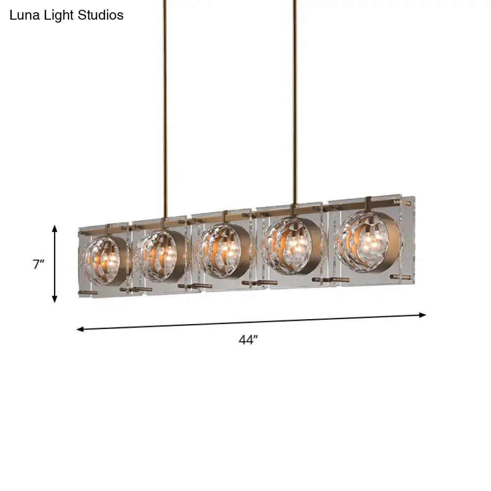 Modern brass pendant light with five faceted crystal spheres in brushed brass for e12 e14 bulbs